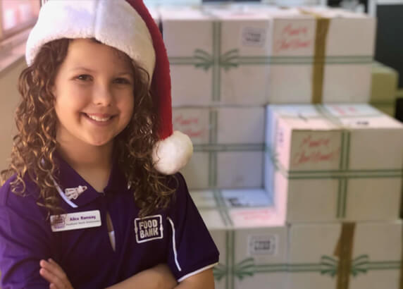 Cute Girl smiling wearing Christmas Hat