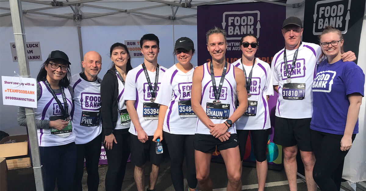 Foodbank team members celebrating after completing Run Melbourne