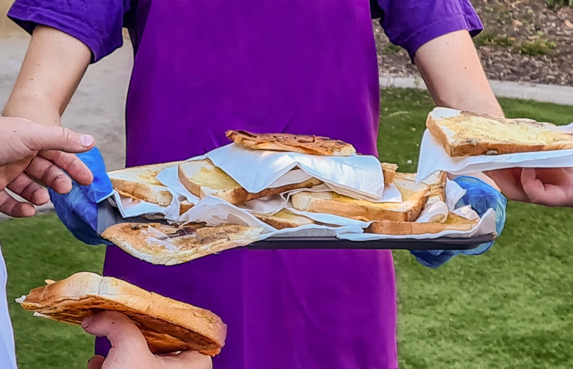 Toasts on a tray being distributed