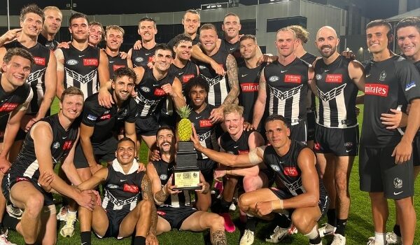Collingwood Players with pineapple trophy