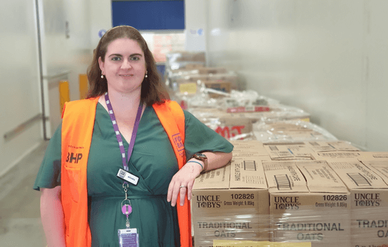 Miranda with pallets for the School Breakfast Program