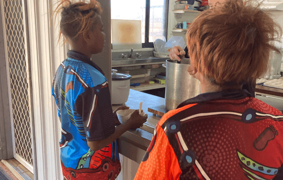 WA - School kids lining up for breakfast at the Balgo School Breakfast Program