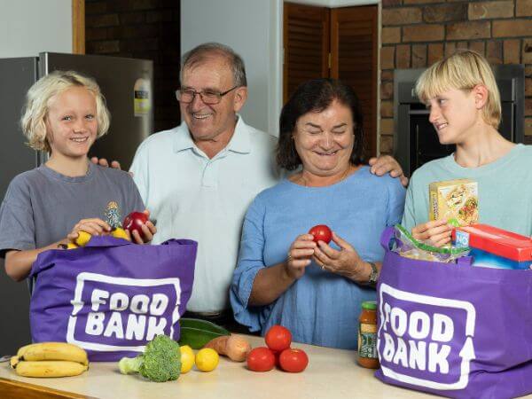FY26 Tax Appeal Food Relief Recipients opening Foodbank totes FBQ Owned