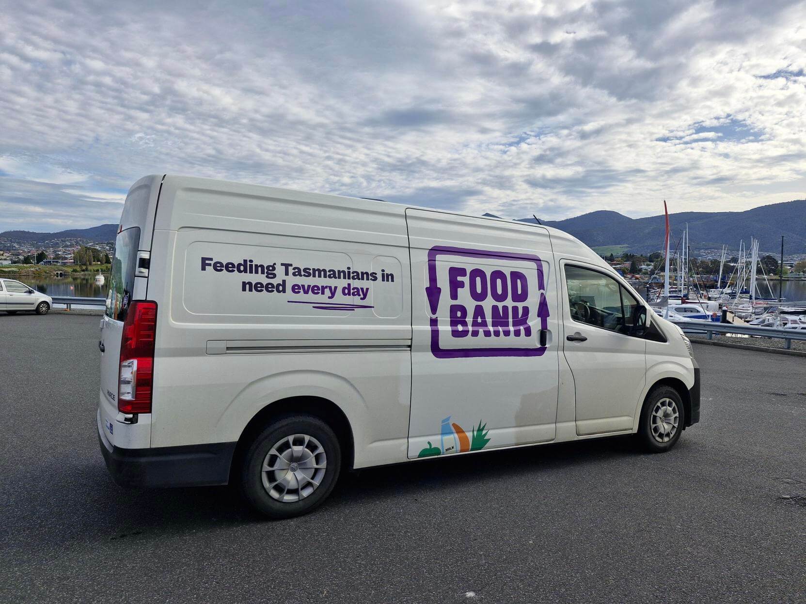 Foodbank branded truck outside of Foodbank Tasmania warehouse