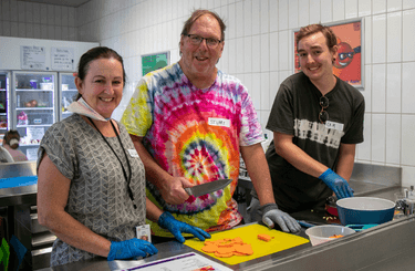 three people preparing healthy meal at Healthy Food for All Abilities Program